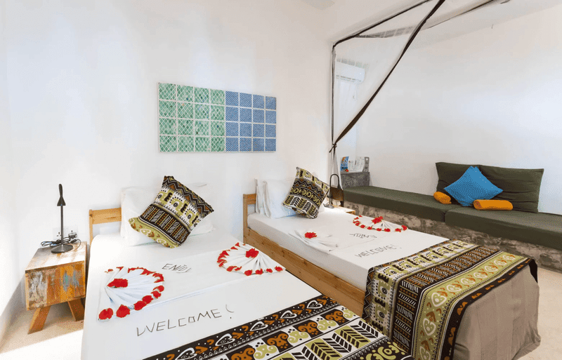 fun beach hotel zanzibar back pool room twin bed